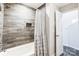 Clean bathroom with a tub and shower, updated finishes at 703 Southwest Dr, Davidson, NC 28036