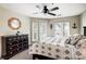 Serene bedroom featuring lake views and a ceiling fan at 703 Southwest Dr, Davidson, NC 28036