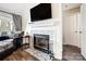 Modern fireplace with stone tile surround in living room at 703 Southwest Dr, Davidson, NC 28036