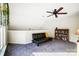 Versatile loft area with a futon and built-in shelving at 703 Southwest Dr, Davidson, NC 28036