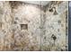 Clean shower with stone tile, glass enclosure at 703 Southwest Dr, Davidson, NC 28036