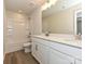 A well-lit bathroom offers a double sink vanity and a shower-tub combo at 8022 Franklin Trail St, Mint Hill, NC 28227