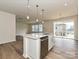 Kitchen island with stainless steel dishwasher and plenty of counter space at 8022 Franklin Trail St, Mint Hill, NC 28227