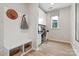 Stylish home office featuring custom built-ins, light wood flooring and a bright window at 8022 Franklin Trail St, Mint Hill, NC 28227