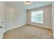 Simple bedroom with neutral wall and carpet at 810 Carisbrooke Ln, Waxhaw, NC 28173