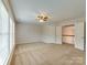 Spacious bedroom with carpet, ceiling fan, and large windows at 810 Carisbrooke Ln, Waxhaw, NC 28173