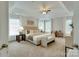 Spacious main bedroom with plush carpeting and large windows at 810 Carisbrooke Ln, Waxhaw, NC 28173