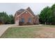 Two-story brick home with a spacious front yard at 810 Carisbrooke Ln, Waxhaw, NC 28173