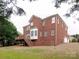 Brick house with deck and attached garage at 810 Carisbrooke Ln, Waxhaw, NC 28173