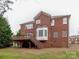 Brick house with deck, stairs, and landscaping at 810 Carisbrooke Ln, Waxhaw, NC 28173