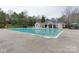 Community swimming pool with a large deck and gazebo at 810 Carisbrooke Ln, Waxhaw, NC 28173