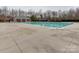 Community pool and surrounding area with tennis courts at 810 Carisbrooke Ln, Waxhaw, NC 28173