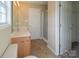 Bathroom with shower, double vanity, and linen closet at 13406 Tartarian Ct, Charlotte, NC 28215