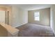 Spacious bedroom with neutral walls and carpet at 13406 Tartarian Ct, Charlotte, NC 28215