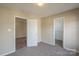 Bedroom with an additional closet and access to another room at 13406 Tartarian Ct, Charlotte, NC 28215