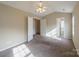 Spacious bedroom with high ceiling and access to multiple rooms at 13406 Tartarian Ct, Charlotte, NC 28215