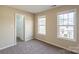 Bright bedroom with two windows and closet at 13406 Tartarian Ct, Charlotte, NC 28215