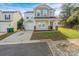 Two-story house with attached garage and small front yard at 13406 Tartarian Ct, Charlotte, NC 28215