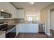 Modern kitchen with granite countertops and stainless steel appliances at 13406 Tartarian Ct, Charlotte, NC 28215