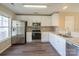 Modern kitchen with stainless steel appliances and granite countertops at 13406 Tartarian Ct, Charlotte, NC 28215