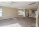 Bright living room with carpeted floors and access to kitchen at 13406 Tartarian Ct, Charlotte, NC 28215