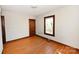 Simple bedroom with hardwood floors and a window at 1909 2Nd Sw Ave, Hickory, NC 28602