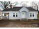 Gray house with a classic design and mature trees in the yard at 1909 2Nd Sw Ave, Hickory, NC 28602