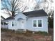 Charming light blue house with white trim and a welcoming front porch at 1909 2Nd Sw Ave, Hickory, NC 28602