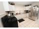 Galley kitchen with white cabinets, granite countertops, and stainless steel appliances at 1909 2Nd Sw Ave, Hickory, NC 28602