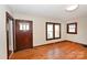 Hardwood floors and classic wooden door in this living room at 1909 2Nd Sw Ave, Hickory, NC 28602