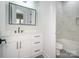 Modern bathroom with white vanity, black matte hardware, and marble-look tile at 2005 Plain Field Dr, Bessemer City, NC 28016