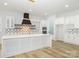 Modern kitchen with white cabinets, quartz countertops, and geometric backsplash at 2005 Plain Field Dr, Bessemer City, NC 28016