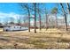 Spacious backyard with mature trees and open space at 2108 Sherwood Forest Ln, Monroe, NC 28110