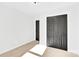 Bright bedroom with neutral walls, carpet, and double doors leading to a closet at 2108 Sherwood Forest Ln, Monroe, NC 28110