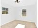 Spacious bedroom with neutral carpet and two windows at 2108 Sherwood Forest Ln, Monroe, NC 28110