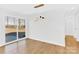 Bright dining area with sliding glass door and hardwood floors at 2108 Sherwood Forest Ln, Monroe, NC 28110