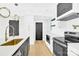 Modern kitchen with gold fixtures and white cabinets at 2108 Sherwood Forest Ln, Monroe, NC 28110