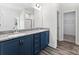 Double vanity bathroom with granite countertop and blue cabinets at 2754 Crowders Creek Rd, Gastonia, NC 28052