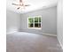 Large bedroom with ceiling fan and access to another room at 2754 Crowders Creek Rd, Gastonia, NC 28052