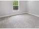 Spacious bedroom with carpeted floor and large window at 2754 Crowders Creek Rd, Gastonia, NC 28052