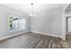 Bright dining room with hardwood floors and chandelier at 2754 Crowders Creek Rd, Gastonia, NC 28052