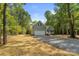 Gray house with a white garage door and landscaping at 2754 Crowders Creek Rd, Gastonia, NC 28052