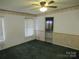 A bright bedroom offers green carpet at 3958 Benny Shrum Ln, Maiden, NC 28650