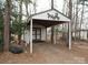 This outbuilding features double doors, a white roof, and an open parking area at 3958 Benny Shrum Ln, Maiden, NC 28650