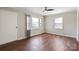 Cozy bedroom with wood floors, ceiling fan, a large window and white trim at 503 N Boyce St, Gastonia, NC 28052