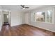 Bright bedroom with wood floors, a large window, ceiling fan, and white trim at 503 N Boyce St, Gastonia, NC 28052