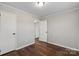 Bedroom showcasing wood floors, neutral walls, and a closet with access to other rooms at 503 N Boyce St, Gastonia, NC 28052