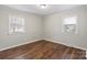 Bedroom with wood floors, neutral walls and two windows providing ample natural light at 503 N Boyce St, Gastonia, NC 28052