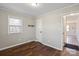 Cozy bedroom with wood floors, neutral walls, closet and natural light through the window at 503 N Boyce St, Gastonia, NC 28052