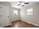 Bright bedroom with hardwood floors and two windows, enhanced by a ceiling fan at 503 N Boyce St, Gastonia, NC 28052